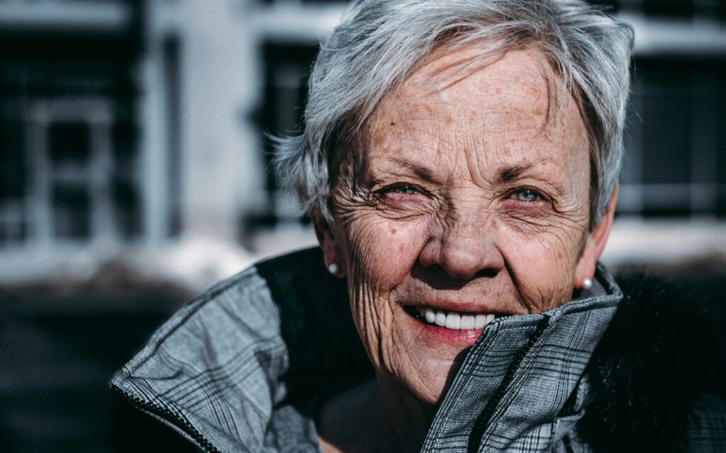 A smiling older woman, representing healthy aging