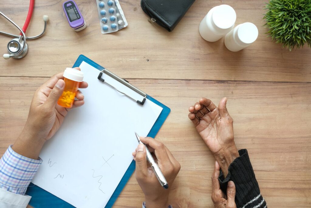 Older adult discussing medication with a clinician